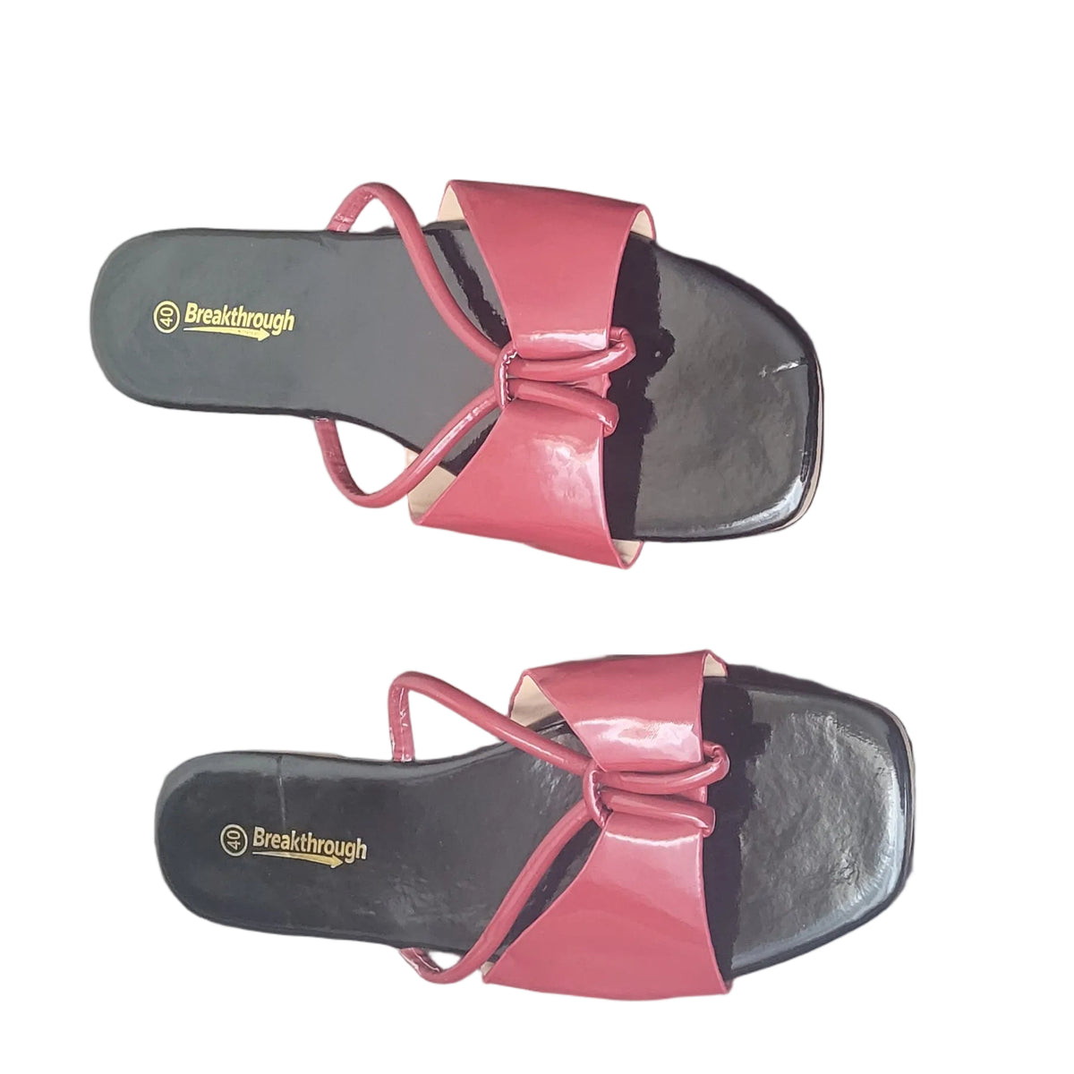 A pair of red and black slide sandals with bow details, displayed on a dark wood floor. The brand name 'Famalogo' is visible on the black footbeds.