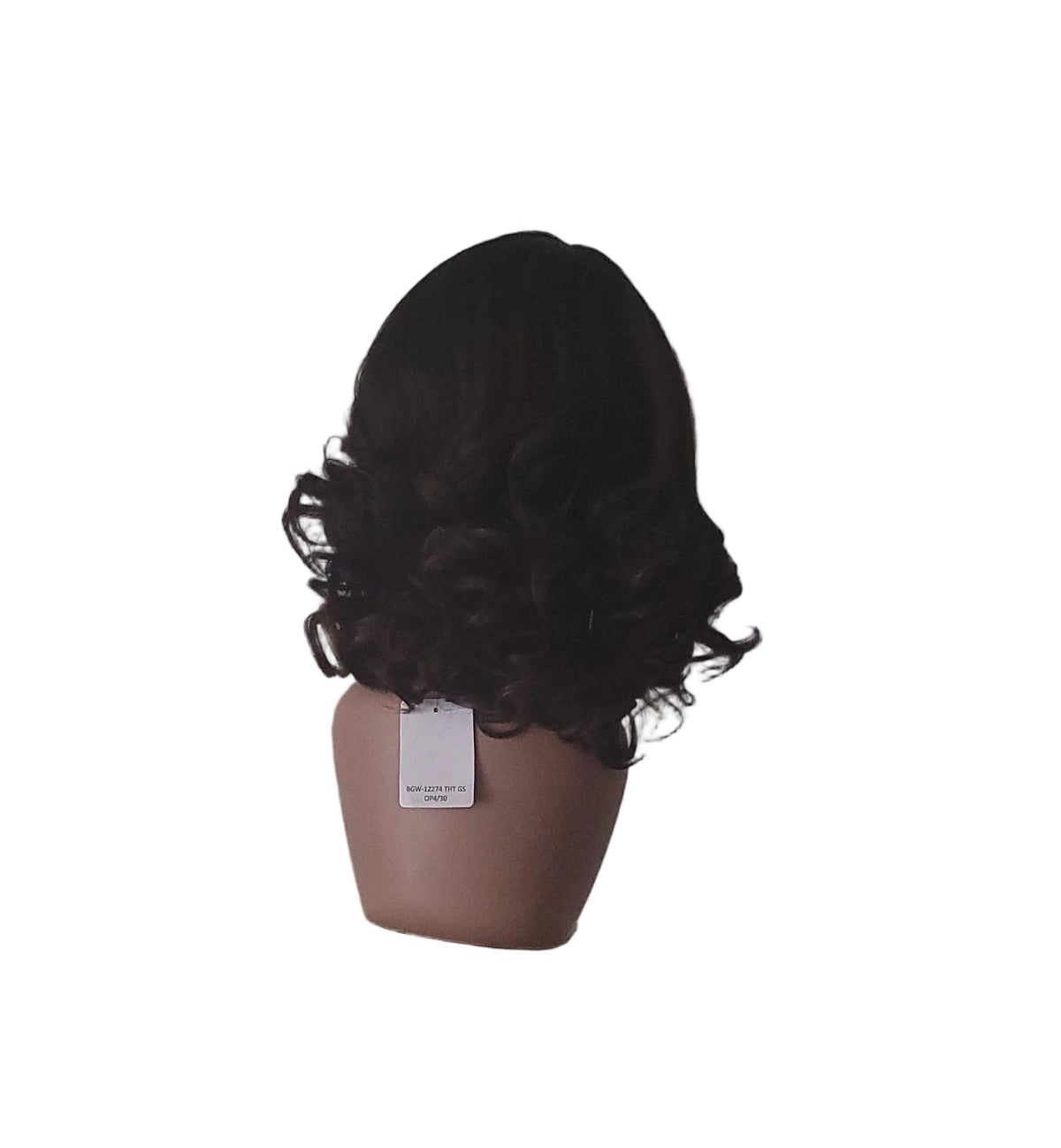 A dark brown, shoulder-length curly wig displayed on a mannequin head mounted on a wooden stand against a textured light gray wall.