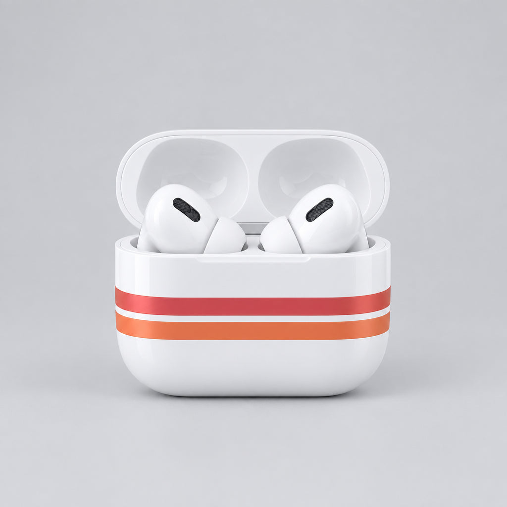 White wireless earbuds in an open white charging case with two orange stripes, photographed on a plain light background.
