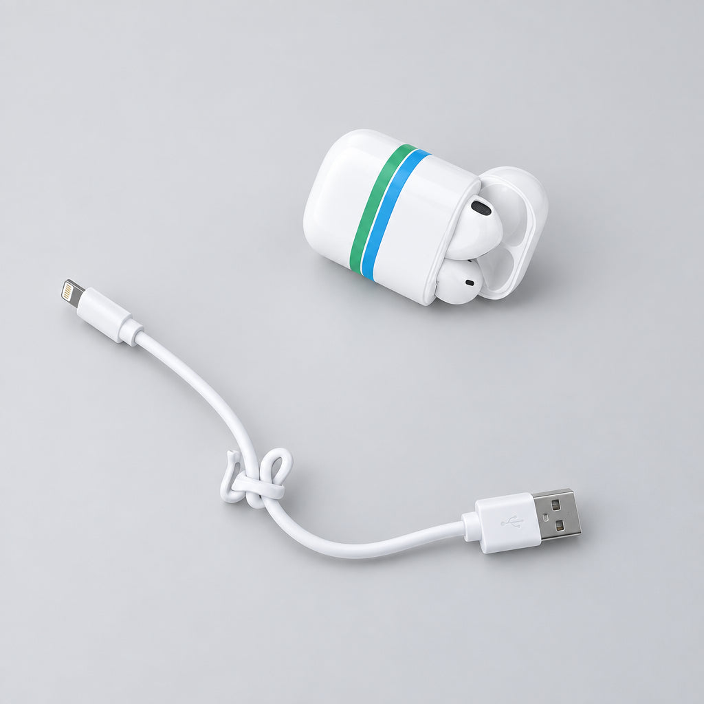 White wireless earbuds and charging case with a thin blue-green accent stripe, shown with a white USB charging cable on a plain off-white surface.