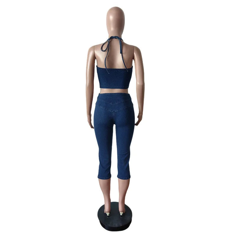 Mannequin wearing a blue sports outfit with 'CM.YAYA' branding on a white background