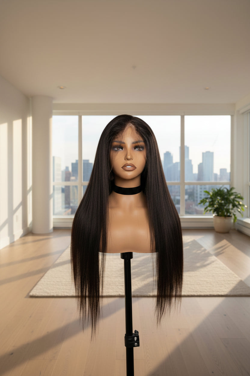 Long, straight black wig with a full lace front, displayed on a mannequin head stand against a dark gray background.