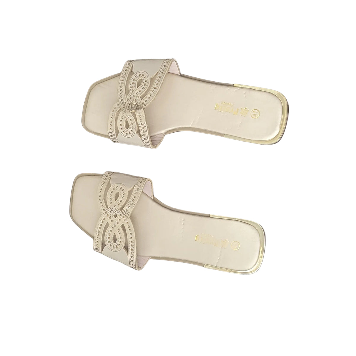 A pair of beige slide sandals with a decorative woven strap, displayed on a dark wood plank floor.