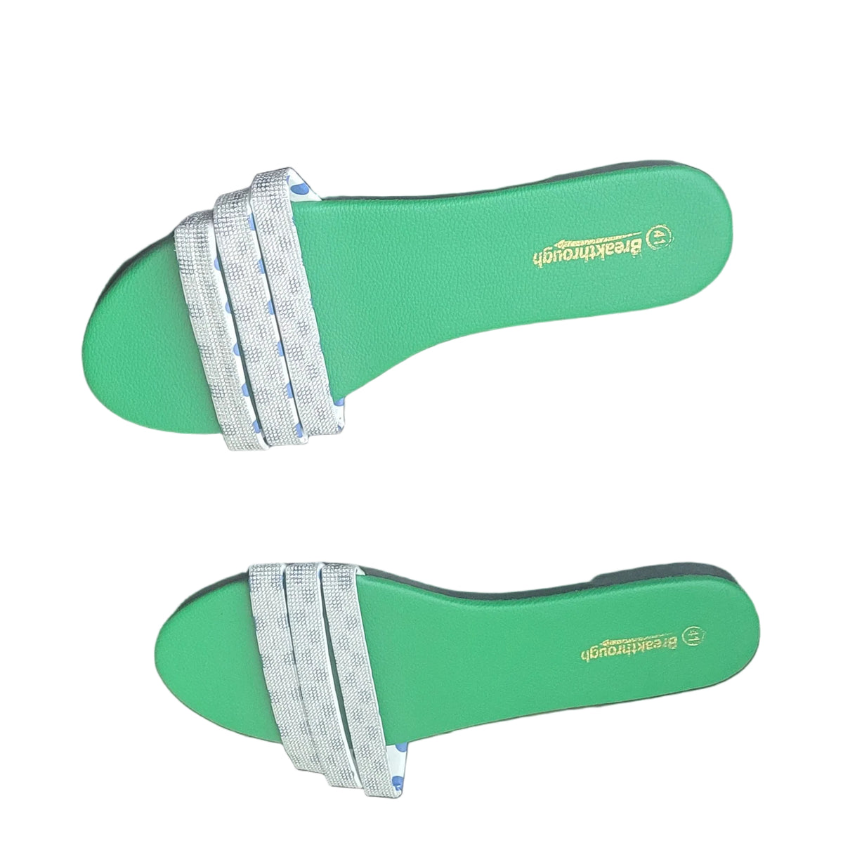 A pair of green orthopedic footbeds with white and blue striped straps, laid flat on a dark wood floor.