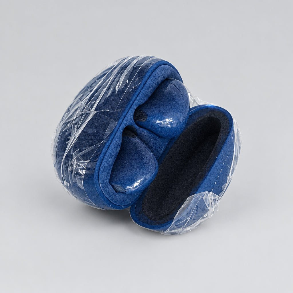A pair of dark blue wireless earbuds inside their matching blue charging case, shown on a plain off-white surface.