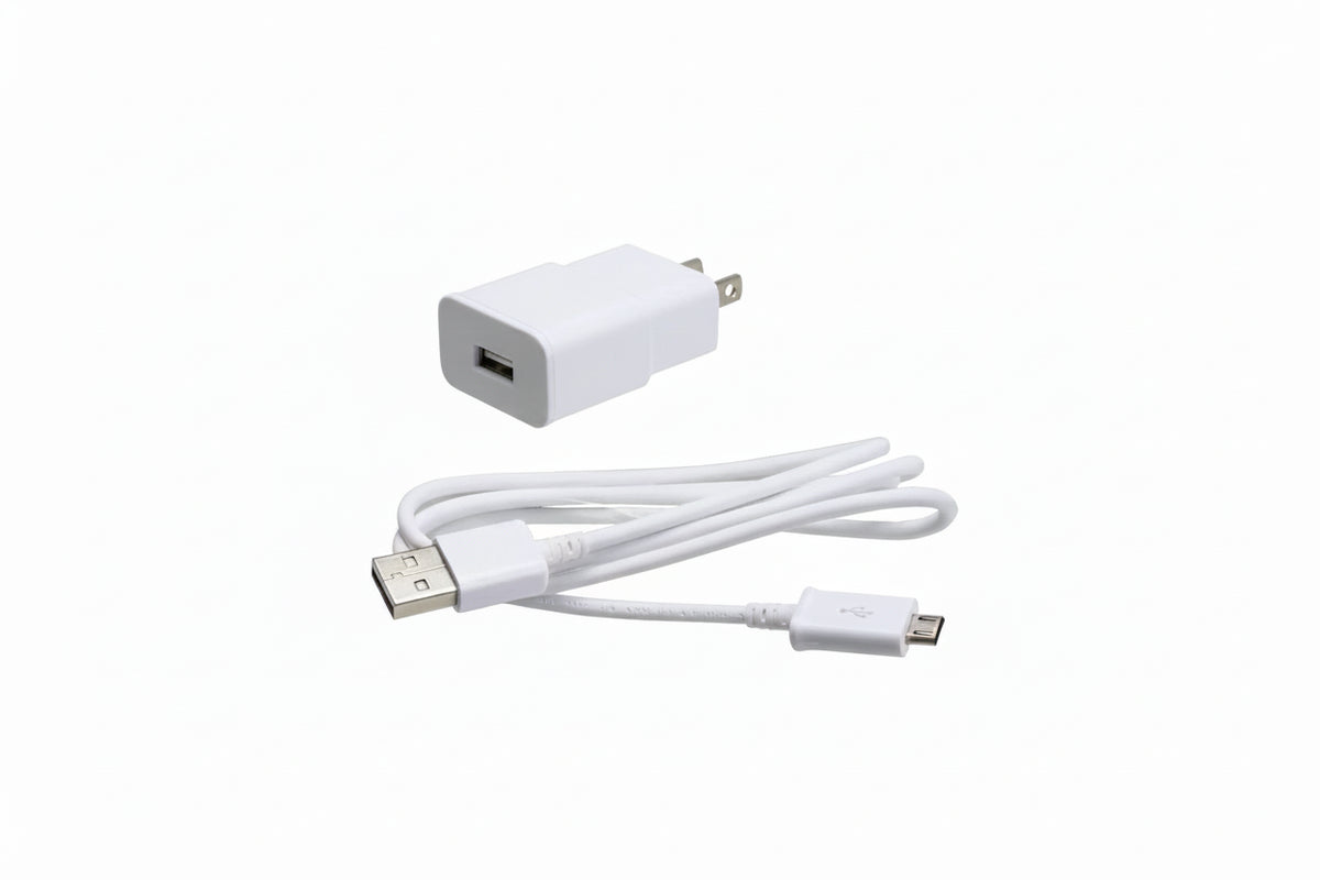 White Samsung USB wall charger adapter with a coiled USB-C to Micro-USB cable, shown on a plain white background.