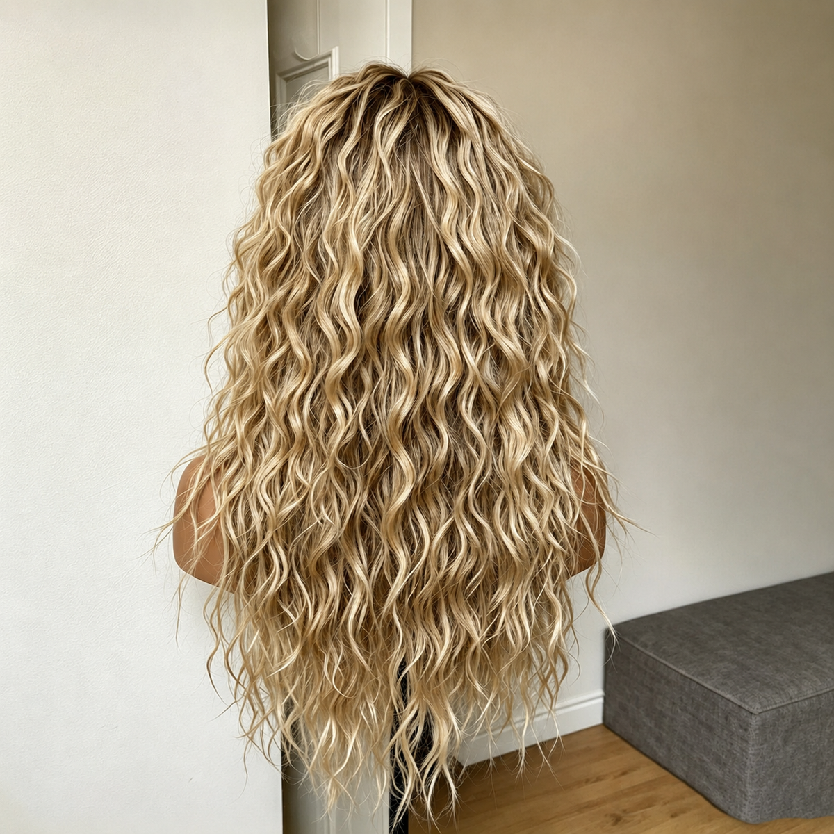 Back view of long ombre blonde curly synthetic wig